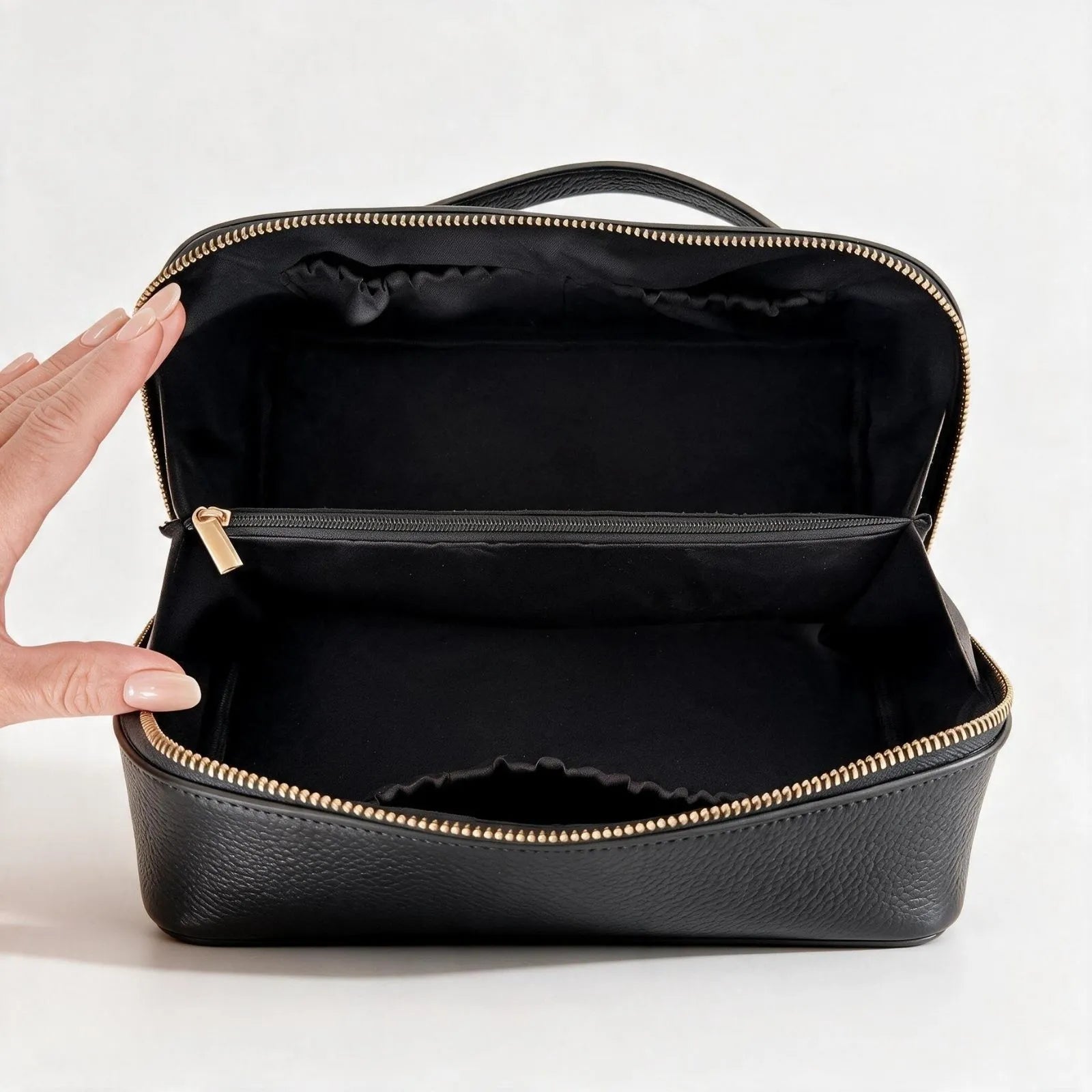 The PURITI Beauty Travel Case open flat, showing its wide opening, black lining and interior zip pocket with a gold-tone zip.